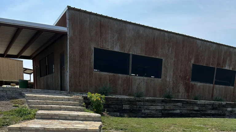 Flagstone steps leading to a modern rustic group rental cabin near Tarleton State University in Stephenville.